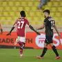 Monaco's Krepin Diatta, center, celebrates after scoring his side's opening goal during the Europa League Group B soccer match between Monaco and Sturm Graz at the Stade Louis II in Monaco, Thursday, Sept. 16, 2021. (AP Photo/Daniel Cole)