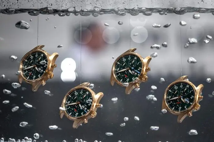 (FILES) Watches are seen in water at the booth of Swiss watch manufacturer IWC on the opening day of the luxury watch fair 'Watches and Wonders Geneva', in Geneva on March 27, 2023. Dozens of economies around the world including the European Union and India are expected to face higher US tariffs on August 7, 2025, as US President Donald Trump’s long-threatened “reciprocal” duties, over trade practices Washington deem unfair, take effect. (Photo by Fabrice COFFRINI / AFP)