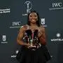 US gymnast Simone Biles poses with her Sportswoman of the Year Award during the 26th Laureus World Sports Awards gala in Madrid on April 21, 2025. (Photo by JAVIER SORIANO / AFP)