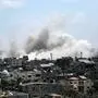 Smoke rises during an Israeli strike in Deir el-Balah in the central Gaza Strip on July 27, 2024, amid the ongoing conflict between Israel and the Palestinian militant group Hamas. (Photo by Bashar TALEB / AFP)