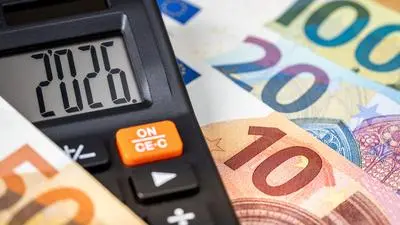 Eurozone 2026 year. Financial business concept. Money and calculator with date 2026. Market analysis. Euro currency.  exchange rate. Economic background. close up