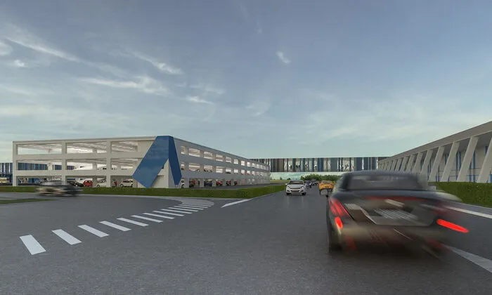 Parkgaragen, Parkplätze und ein überdachtes Übergangsband zum neuen Bahnhof werden gerade gebaut