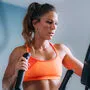 Woman Exercising on Elliptical Cross Trainer