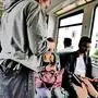 Symbolfoto: Fahrscheinkontrolle in einer fahrenden Straßenbahn, ein Mann steht vor sitzenden Fahrgästen und lässt sich die Fahrscheine zeigen
