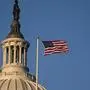 A US flag flies near the dome of the US Capitol building in Washington, DC on December 18, 2019 as the US House of Representatives debates two articles of impeachment against the US president. (Photo by Alex Edelman / AFP)
