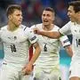 Italy's midfielder Nicolo Barella (L) celebrates with teammates after scoring the team's first goal during the UEFA EURO 2020 quarter-final football match between Belgium and Italy at the Allianz Arena in Munich on July 2, 2021. (Photo by Christof STACHE / POOL / AFP)
