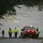 First responders scan the banks of the Guadalupe River for individuals swept away by flooding in Ingram, Texas, Thursday, July 4, 2025. (Michel Fortier/The San Antonio Express-News via AP)