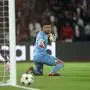Girona's Argentine goalkeeper #13 Paulo Gazzaniga (R) watches as the shot from Paris Saint-Germain's French forward #23 Randal Kolo Muani (L) misses the goal during the UEFA Champions League 1st round day 1 football match between Paris Saint-Germain (PSG) and Girona FC at the Parc des Princes Stadium, in Paris, on September 18, 2024. (Photo by FRANCK FIFE / AFP)