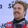Race winner Norway's Aleksander Aamodt Kilde celebrates on the podium after the Men's Downhill event during the FIS Alpine ski World Cup in Val Gardena on December 17, 2022. (Photo by Tiziana FABI / AFP)