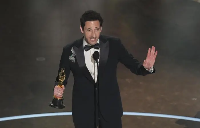 Adrien Brody accepts the award for best performance by an actor in a leading role for 