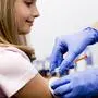 Vaccine - a doctor giving  vaccination girl, health, prevention