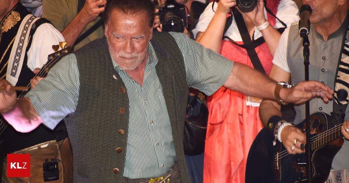 Arnold Schwarzenegger celebrates with his colleague at Oktoberfest