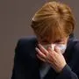 (FILES) In this file photo taken on December 16, 2020 German Chancellor Angela Merkel puts her face protection mask on after a session of the Bundestag (lower house of parliament) in Berlin, amid the coronavirus Covid-19 pandemic. - Chancellor Angela Merkel on January 16, 2021 said significantly tougher measures were needed to slow Germany's coronavirus infections, party sources told AFP. Speaking at a meeting with top brass from her centre-right CDU party, Merkel said "the virus can only be stopped with significant additional efforts", participants told AFP, adding that the chancellor wanted to hold fresh crisis talks with regional leaders next week. (Photo by Odd ANDERSEN / AFP)