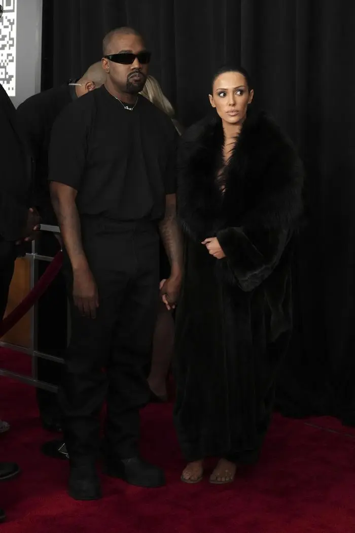 Kanye West, left, and Bianca Censori arrive at the 67th annual Grammy Awards on Sunday, Feb. 2, 2025, in Los Angeles. (Photo by Jordan Strauss/Invision/AP)