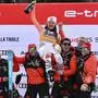 Germany's Emma Aicher, winner, celebrates with her team on the podium of the Women's Super G event of FIS Alpine Skiing World Cup in La Thuile, Italy on March 13, 2025. Germany's Emma Aicher won the race ahead of Italy's Sofia Goggia and Italy's Federica Brignone. (Photo by Marco BERTORELLO / AFP)