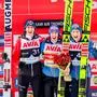 (L-R) Silver medal Austria's Daniel Tschofenig, gold medal Austria's Stefan Kraft and Austria's Jan Hoerl celebrate on the podium after winning the Men's Individual HS 138 event of the FIS world cup ski jumping competition in Trondheim, on March 13, 2024. (Photo by Geir Olsen / NTB / AFP) / Norway OUT