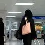 A Saudi woman rolls her suitcase at the departure hall of the Jeddah Airport on August 6, 2019. - Saudi Arabia's easing of travel restrictions on women was hailed in the kingdom last week as a historic leap for gender equality, but it also drew anger from hardliners backing contentious male "guardianship" rules. The Muslim kingdom announced it was effectively allowing women over the age of 21 to obtain passports and travel abroad without securing the permission of their "guardians" -- husband, father or other male relatives. (Photo by - / AFP)