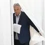 TOPSHOT - Hungarian Prime Minister Viktor Orban exits a polling booth to cast his ballot at a polling station located in a school in Budapest during the European and local elections on June 9, 2024. (Photo by Attila KISBENEDEK / AFP)