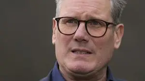 Britain's Labour Party leader Keir Starmer speaks to a media outlet during an election campaign stop at a pub near Milton Keynes, England, Monday, July 1, 2024. Britain goes to the polls on July 4. (AP Photo/Kin Cheung)