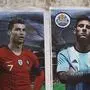 A football fan pastes posters of football players (L-R) Portugal's Cristiano Ronaldo, Argentina's Leo Messi and Brazil's Neymar Jr. on a wall ahead of the Qatar 2022 FIFA World Cup football tournament, in Karachi on November 12, 2022. (Photo by Rizwan TABASSUM / AFP)