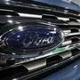 FILE - In this file photo dated Thursday, March 28, 2019, the Ford Motor company logo at the auto show in Denver, USA.  Carmaker Ford said Thursday June 27, 2019, it is shedding 12,000 jobs in Europe as it streamlines operations in the region to increase profitability. (AP Photo/David Zalubowski)