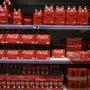 (FILES) This photograph taken on November 3, 2022 shows packs of Coca-Cola bottles on a supermarket shelf in Septemes-les-Vallons near Marseille. The European bottling unit of giant soda maker Coca-Cola on January 27, 2025 said it has ordered a major recall of Coke, Sprite, Fanta and other beverages after checks identified high levels of chlorate. The recall concerns cans and glass bottles distributed in Belgium, the Netherlands, Britain, Germany, France and Luxembourg since November, Coca-Cola Europacific Partners Belgium told AFP, adding that while it did "not have a precise figure" a "considerable quantity" of drinks were affected. (Photo by Christophe SIMON / AFP)