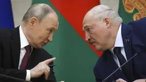 FILE - Russian President Vladimir Putin, left, and Belarusian President Alexander Lukashenko talk during a signing ceremony in Minsk, Belarus, Dec. 6, 2024. (Gavriil Grigorov, Sputnik, Kremlin Pool Photo via AP, File)