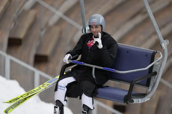 Jarl Magnus Riiber, of Norway, rides the lift during the nordic combined men's team Gundersen LH/4X5 km competition at the Nordic World Ski Championships in Trondheim, Norway, Friday, March 7, 2025. (AP Photo/Matthias Schrader)
