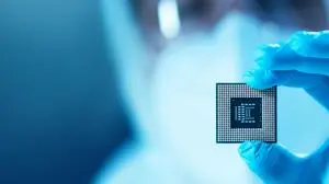 Professional scientist works in a modern scientific laboratory for the research and development of microelectronics and processors. Microprocessor manufacturing worker uses computer technology and equipment.