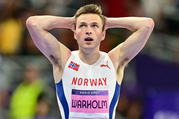 Second placed Norway's Karsten Warholm reacts after the men's 400m hurdles final of the athletics event at the Paris 2024 Olympic Games at Stade de France in Saint-Denis, north of Paris, on August 9, 2024. (Photo by Martin  BERNETTI / AFP)
