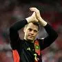 (FILES) Germany's goalkeeper #01 Manuel Neuer celebrates after winning the UEFA Euro 2024 Group A football match between Germany and Hungary at the Stuttgart Arena in Stuttgart on June 19, 2024. Germany goalkeeper Manuel Neuer, a 2014 World Cup winner, on August 21, 2024  announced his retirement from international football on social media. Neuer, 38, played 124 matches for Germany, captaining the side 61 times. (Photo by Tobias SCHWARZ / AFP)