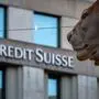 A sign of Credit Suisse bank is seen on a branch building in Geneva, on March 15, 2023. - Credit Suisse shares nosedived on March 15, 2023, after its main shareholder said it would not provide more funding, with reassuring comments from the Swiss bank's chairman unable to calm the market panic. (Photo by Fabrice COFFRINI / AFP)