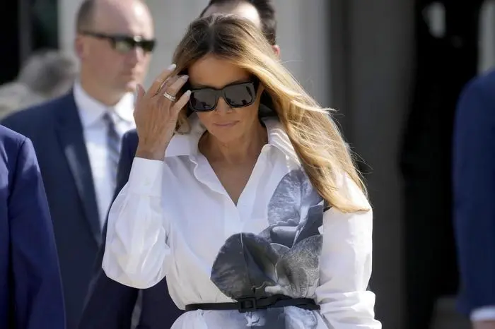 FILE - Former first lady Melania Trump leaves after voting in the Florida primary election in Palm Beach, Fla., March 19, 2024. After Melania Trump missed key events in her husband's campaign, she told reporters asking about her thin schedule to “stay tuned.” But in the months since, she has largely refrained from public appearances. (AP Photo/Wilfredo Lee, File)