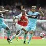 epa04878274 Arsenal's Theo Walcott (C) vies for the ball with West Ham's Mark Noble (R) during the English Premier League soccer match between Arsenal and West Ham at the Emirates Stadium, in London, Britain, 09 August 2015. EPA/GERRY PENNY EDITORIAL USE ONLY. No use with unauthorized audio, video, data, fixture lists, club/league logos or 'live' services. Online in-match use limited to 75 images, no video emulation. No use in betting, games or single club/league/player publications