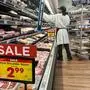 An employee restocks the shelves in the meat section of a supermarket in Monterey Park, California, on February 12, 2025. Major US indices began the day firmly in the red after January US consumer price index data showed inflation grew, raising questions about whether the Federal Reserve's progress on bringing down prices was reversing. (Photo by Frederic J. BROWN / AFP)