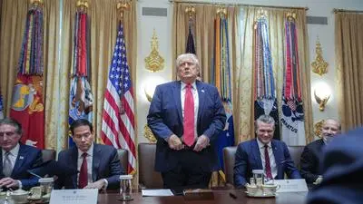 United States President Donald J Trump stands-up to depart after holding a meeting with his Cabinet in the Cabinet Room of the White House in Washington, DC, USA, on Tuesday, December 2, 2025. Pictured from left to right: United States Secretary of the Interior and Chair, National Energy Council and White House Energy Czar Doug Burgum United States Secretary of State Marco Rubio, United States Secretary of War Pete Hegseth and United States Secretary of Commerce Howard Lutnick. Copyright: xCNPx/xMediaPunchx
