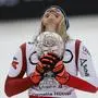 Conny Hütter | Austria's Cornelia Huetter holds the women's World Cup downhill discipline trophy after completing an alpine ski women's World Cup downhill, in Saalbach, Austria, Saturday, March 23, 2024. (AP Photo/Alessandro Trovati)