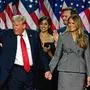 TOPSHOT - -- AFP PICTURES OF THE YEAR 2024 --

Former US President and Republican Presidential candidate Donald Trump gestures at supporters as he holds hands with former US First Lady Melania Trump during an election night event at the West Palm Beach Convention Center, in West Palm Beach, Florida, early on November 6, 2024. . Republican former president Donald Trump closed in on a new term in the White House early November 6, 2024, just needing a handful of electoral votes to defeat Democratic Vice President Kamala Harris. (Photo by Jim WATSON / AFP) / AFP PICTURES OF THE YEAR 2024