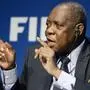 Issa Hayatou, acting FIFA President speaks during a news  conference at the FIFA Headquarters ' in Zurich, Switzerland, Thursday, Dec. 3,  2015.   (Walter Bieri/Keystone via AP)