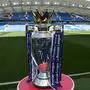 (FILES) In this file photo taken on August 12, 2017 The Premier league trophy sits beside the pitch ahead of the English Premier League football match between Brighton and Hove Albion and Manchester City at the American Express Community Stadium in Brighton. - Premier League clubs will meet on May 1, 2020, to discuss whether it is realistic to complete the season during the coronavirus crisis or whether they will have to brace for a devastating financial hit. (Photo by CHRIS J RATCLIFFE / AFP) / RESTRICTED TO EDITORIAL USE. No use with unauthorized audio, video, data, fixture lists, club/league logos or 'live' services. Online in-match use limited to 75 images, no video emulation. No use in betting, games or single club/league/player publications. /