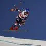 United States' Mikaela Shiffrin is airborne during an alpine ski, women's World Cup downhill race, in St. Moritz, Switzerland, Saturday, Dec.9, 2023. (AP Photo/Giovanni Maria Pizzato)