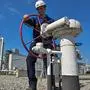 A worker operates equipment operated by GCA (Gas Connect Austria) and TAG (Trans Austria Gas pipelines) at one of the largest interconnection gas hubs in Europe at Baumgarten an der March, Lower Austria. - The facility mainly receives Russian imports, but takes also shipments of gas from Norway and some other countries. These supplies are re-routed to consumption centers in Austria and in Europe via a number of pipeline systems running in various directions. The Baumgarten hub consists of gas reception, metering and testing facilities. (Photo by JOE KLAMAR / AFP)
