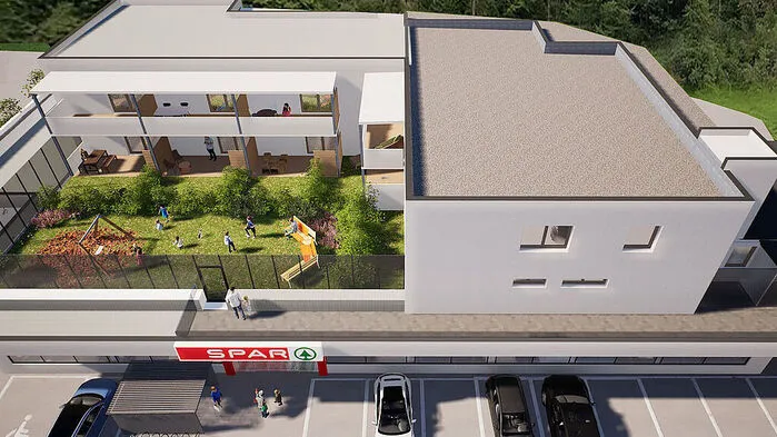 Eine Visualisierung zeigt den Wohnkomplex mit Spar-Markt im Erdgeschoss und Kinderspielplatz auf dem Dach