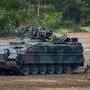 (FILES) This file photo taken on May 20, 2019 shows a Marder battle tank of the German armed forces Bundeswehr driving during an informative educational practice of the "Very High Readiness Joint Task Force (VJTF)", which is part of a NATO tank unit, at the military training area in Munster, northern Germany. - Berlin and Washington are coordinating a "qualitative new step" in their weapon deliveries to Ukraine, German government sources told AFP on January 5, 2023, with calls growing for Germany to up its contribution. Germany will follow the US in providing a Patriot missile defence system to Ukraine, and also will deliver Marder tanks. (Photo by PATRIK STOLLARZ / AFP)