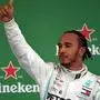 Mercedes' British driver Lewis Hamilton celebrates at the podium after getting the third place in the F1 Brazil Grand Prix, at the Interlagos racetrack in Sao Paulo, Brazil on November 17, 2019. (Photo by Carl DE SOUZA / AFP)