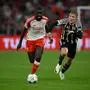 Bayern Munich's French defender #02 Dayot Upamecano (L) and Manchester United's Danish striker #11 Rasmus Hojlund vie for the ball during the UEFA Champions League Group A football match FC Bayern Munich v Manchester United in Munich, southern Germany on September 20, 2023. (Photo by Tobias SCHWARZ / AFP)