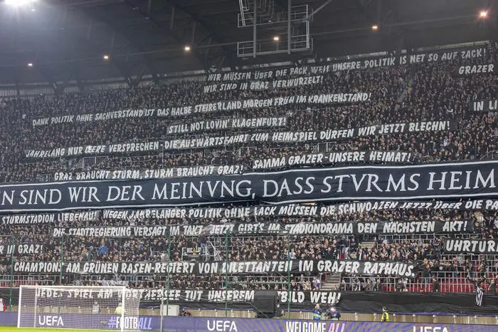 KLAGENFURT,AUSTRIA,02.OCT.24 - SOCCER - UEFA Champions League, SK Sturm Graz vs Club Brugge. Image shows fans of SK Sturm Graz with a banner. 
Photo: GEPA pictures/ Matthias Trinkl
