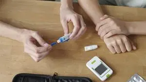 Hands using glucometer for blood glucose check and diabetes care model released, Symbolfoto property released, DSHF02359