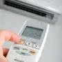 Closeup view about using some appliance such as air condition.