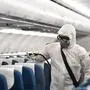 This handout from Vietnam Airlines taken on February 4, 2020 and released on February 5, 2020 shows a staff member wearing a protective suit while disinfecting a Vietnam Airlines plane at Noi Bai International Airport in Hanoi. - Health officials in Vietnam on February 5 said all foreign passport holders -- including from China, Hong Kong and Macau -- that have been to mainland China in the past 14 days will not be permitted to enter Vietnam, in a bid to limit the spread of the novel coronavirus, which is believed to have originated in the central Chinese city of Wuhan. (Photo by Handout / VIETNAM AIRLINES / AFP) / -----EDITORS NOTE --- RESTRICTED TO EDITORIAL USE - MANDATORY CREDIT "AFP PHOTO / VIETNAM AIRLINES " - NO MARKETING - NO ADVERTISING CAMPAIGNS - DISTRIBUTED AS A SERVICE TO CLIENTS - NO ARCHIVE